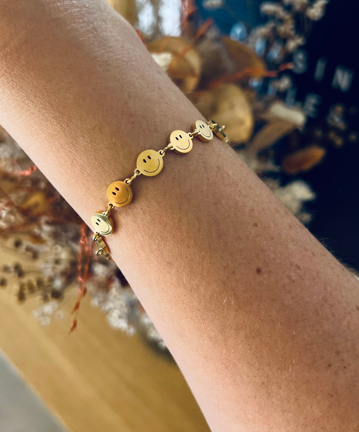 Smiley armband goud